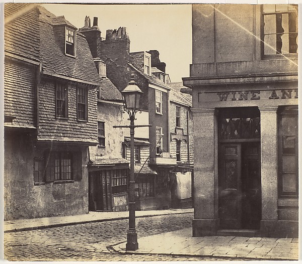 Unknown, [Street with Lamp Post and Wine Shop]