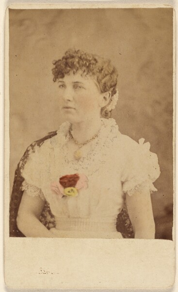 Unknown, [Unidentified woman wearing flower embellished dress, seated]