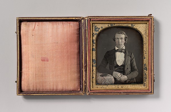 Unknown, [Seated Young Man Resting Arm on Table Beside Daguerreotype Case]
