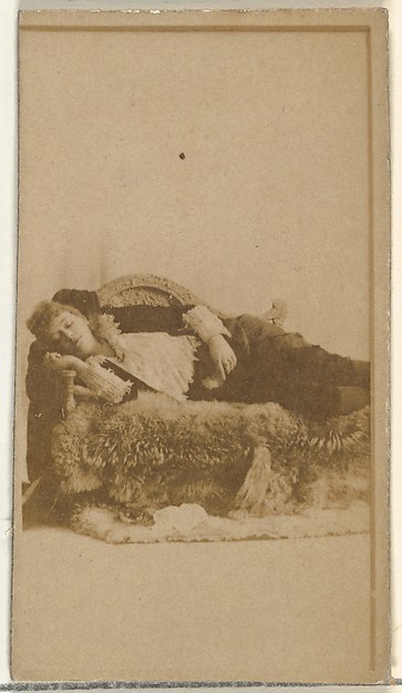 W. Duke, Sons & Co., [Actress reclining on furs], from the Actors and Actresses series (N145-8) issued by Duke Sons & Co. to promote Duke Cigarettes