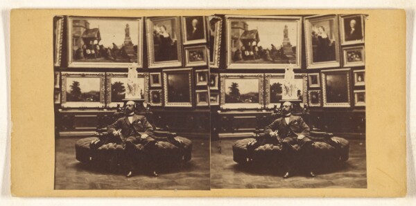 Unknown, [Private residence art gallery with bearded, bald gentleman seated on circular couch, holding possibly a carte-de-visite album]