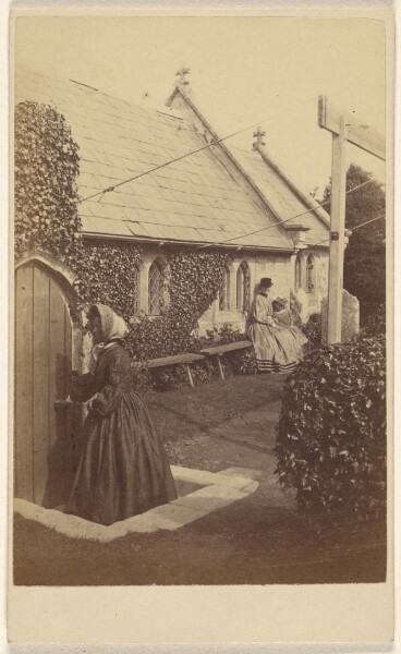 Unknown, [Ivy-covered church with two unidentified women seated on a bench, and another at door]