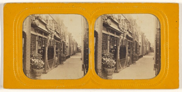 Unknown, [Angled view of a row of shops]