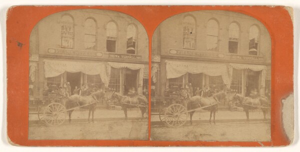 Unknown, [Two horse-drawn wagons in front of the building of the companies of Frank Steele and William Yerrall]
