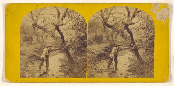 Unknown, [Man wearing floppy hat, holding shovel, fording a stream]