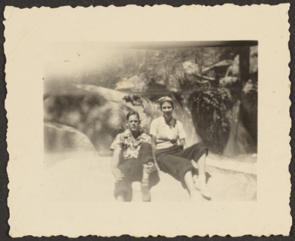Louis Fleckenstein, [Man and Woman Sitting on Large Rock]