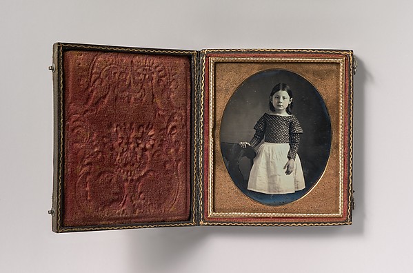 Unknown, [Young Girl Wearing Waist Apron, Resting Hand on Chair]