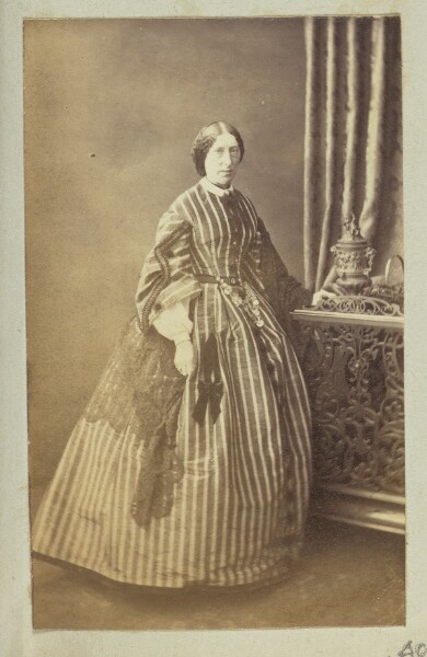 Unknown, [Portrait of woman in striped dress]