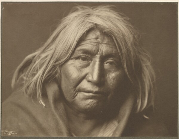 Edward S. Curtis, [An Apache]