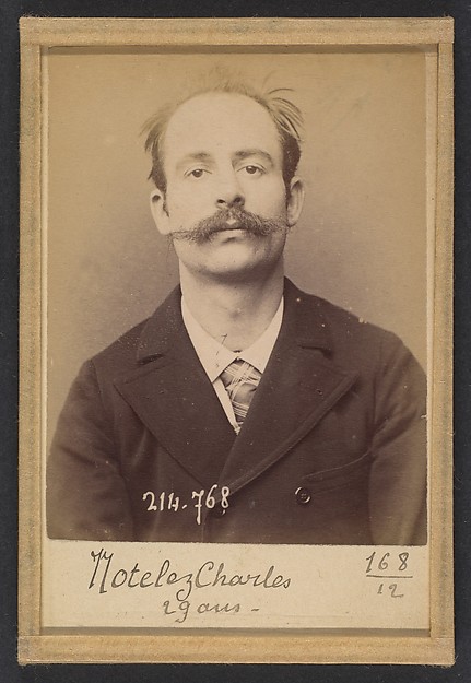 Alphonse Bertillon, Notelez. Charles, Émile. 29 ans, né à Paris XXe. Portefeuilliste. Anarchiste. 26/2/94.