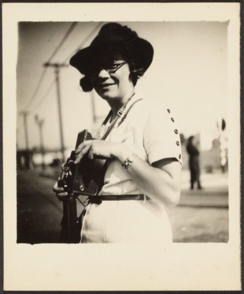 Louis Fleckenstein, [Woman Holding Camera]