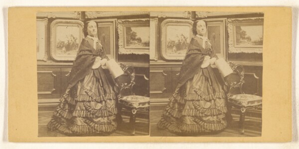 Unknown, [Woman posed in a parlor, paintings on the wall]