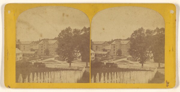 Unknown, [Long view of several large buildings, white picket fence in foreground]