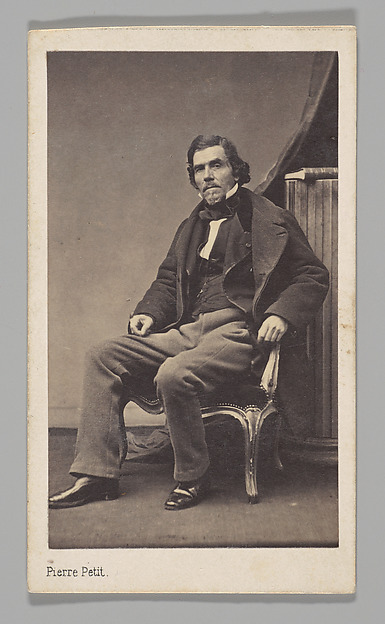 Pierre Petit, [Studio Portrait: Eugène Delacroix Seated in Chair]