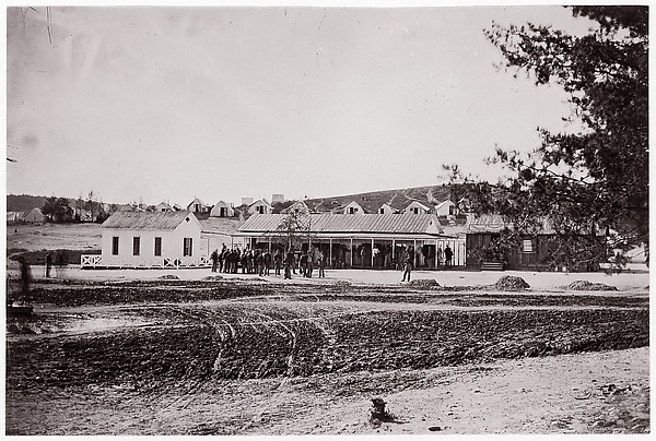 Unknown, [Winter Quarters of Unidentified Union Army Encampment with Ambrotype and Photograph Gallery]