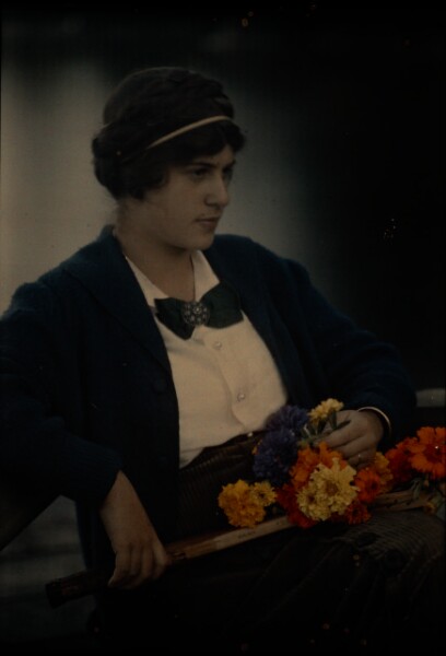 Alfred Stieglitz, [Woman with tennis racket and flowers]
