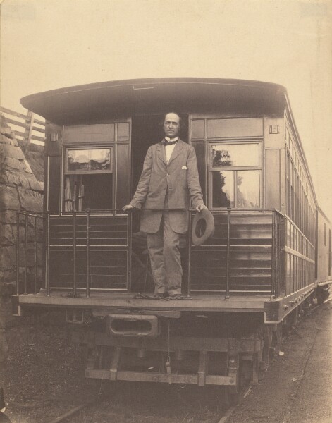 Unknown, [Portrait of an unidentified man standing on rear platform of a train]