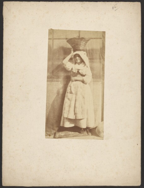Unknown, [Woman with basket on head]