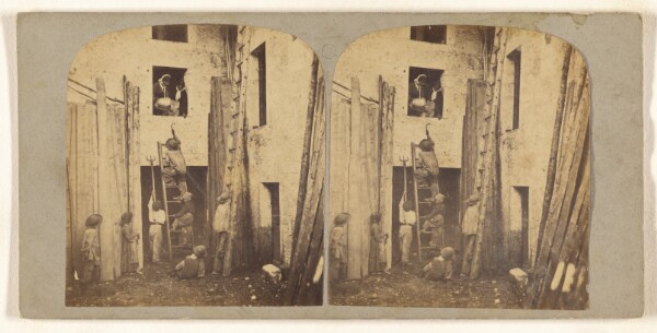 Unknown, [Young boys climbing ladder up to window where two woman are dumping water on them]