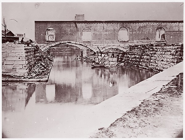 Alexander Gardner, [Canal and Ruins of Richmond and Danville Railroad Depot, Richmond, Virginia]