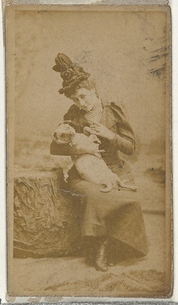 W. Duke, Sons & Co., [Actress cradling small dog], from the Actors and Actresses series (N145-8) issued by Duke Sons & Co. to promote Duke Cigarettes
